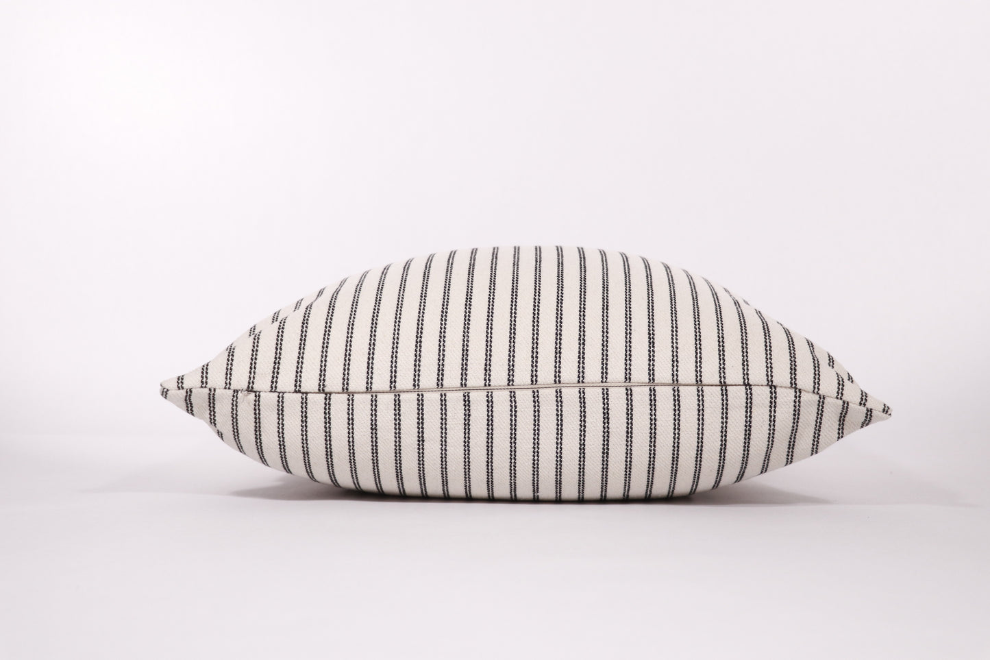 Black and ivory stripe 18x18 pillow cover zipper closure detail.