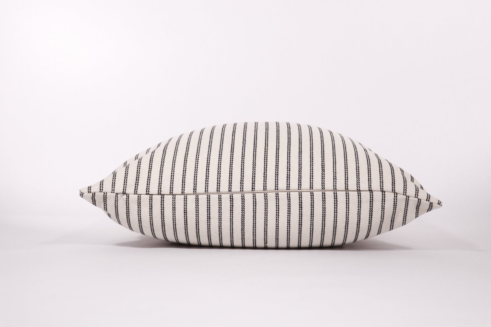 Black and ivory stripe 18x18 pillow cover zipper closure detail.