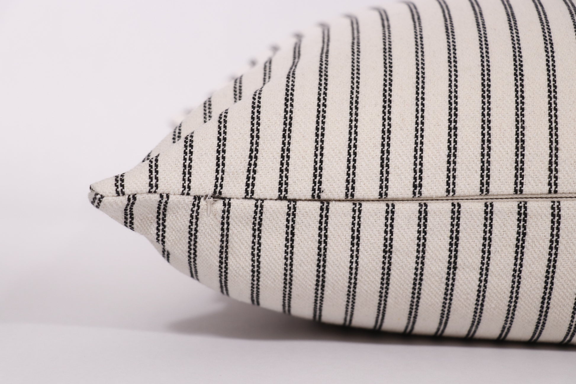 Close up of zipper closure on the 18x18 Amelia pillow cover.