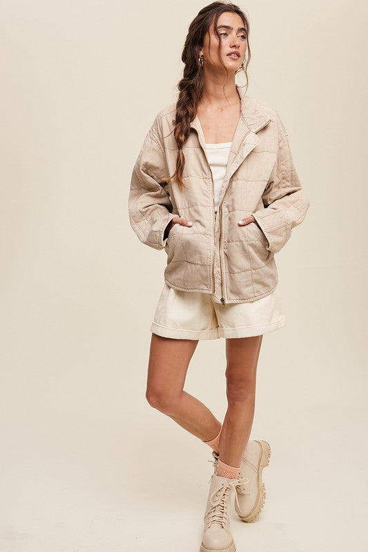 Model wearing quilted denim jacket.