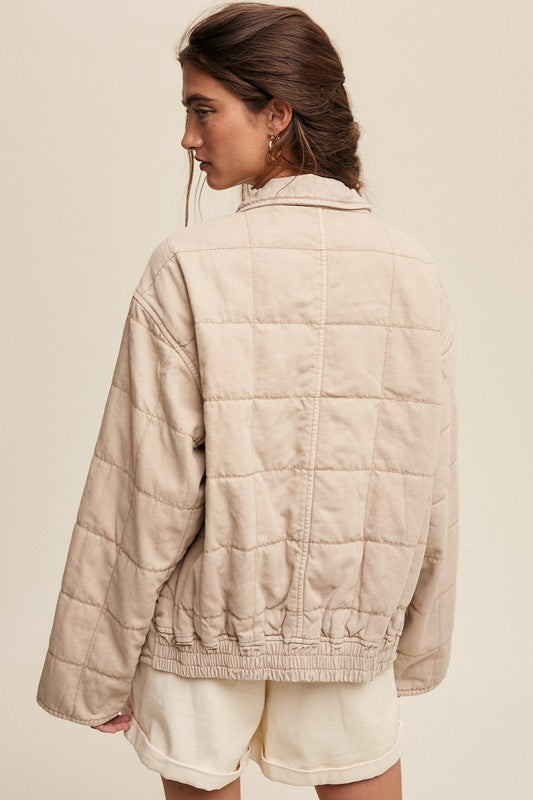 Back view of quilted denim jacket.