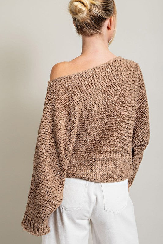 Back view of loose fit boatneck sweater.
