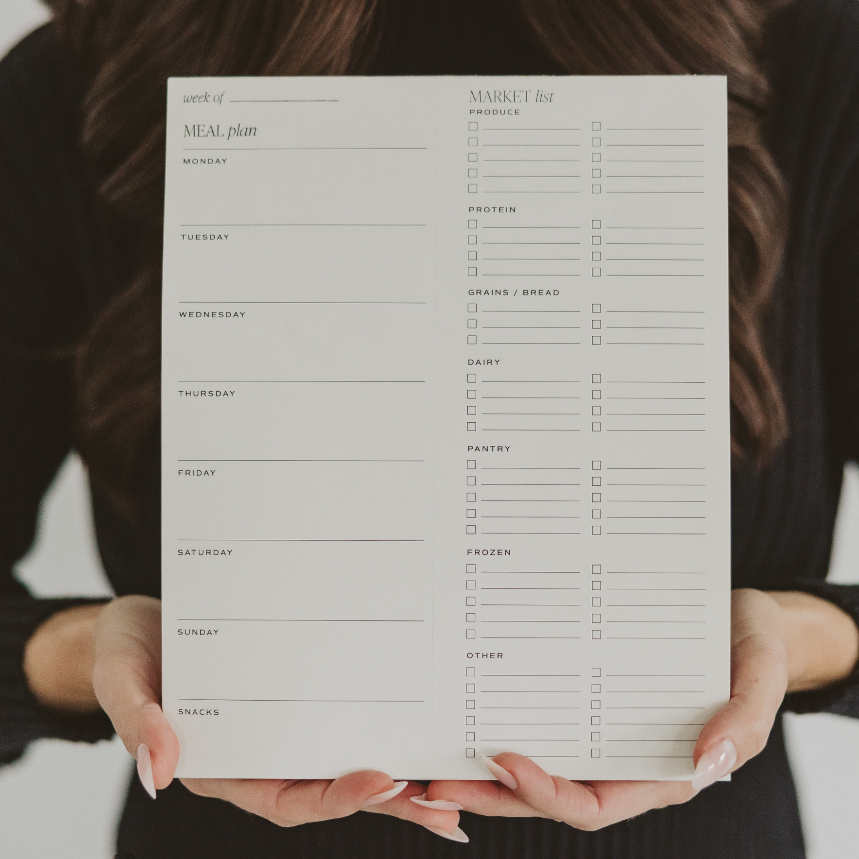 Woman Holding Weekly Meal Planner